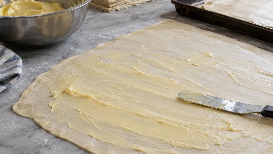 Image showing spreading fat stretched dough